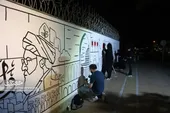 دیوارنگاره &laquo;قوموالله&raquo; کار مشترک هنرمندان لبنانی و مشهدی است